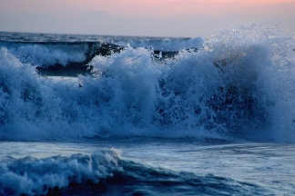 Crashing waves of a surging ocean